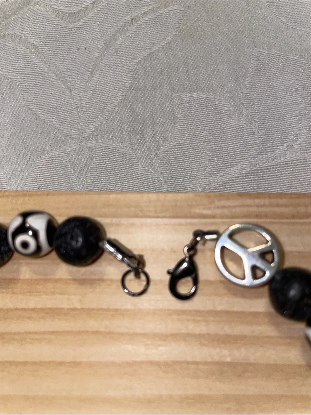 9-Bead Tibetan polish bead Anklet with lava beads and peace signs.